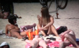 nudist-beach-voyeur-spying-on-a-busty-milf-and-a-cute-teen